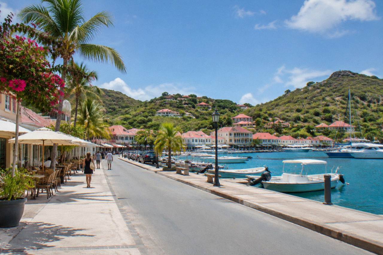 A quiet street in Gustavia with shops and cafes along the harbour front on St Barts
