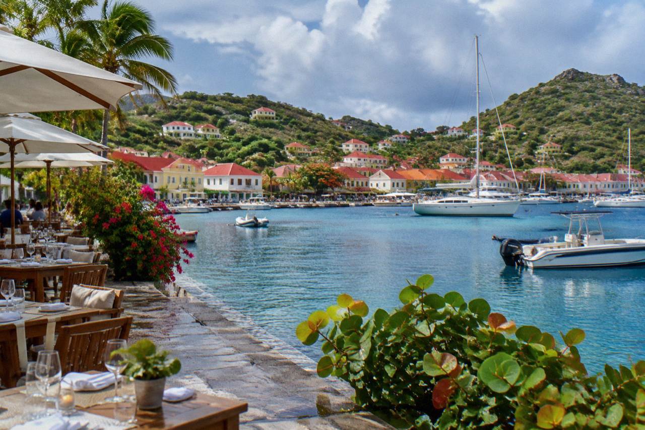 Evening tables set beside the harbour in Gustavia on St Barts