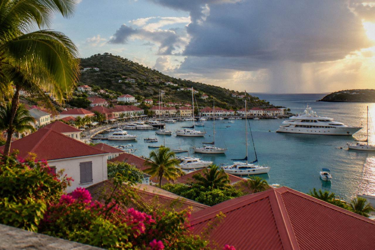 Evening view over red rooftops and yachts in the harbor of Gustavia on St Barts