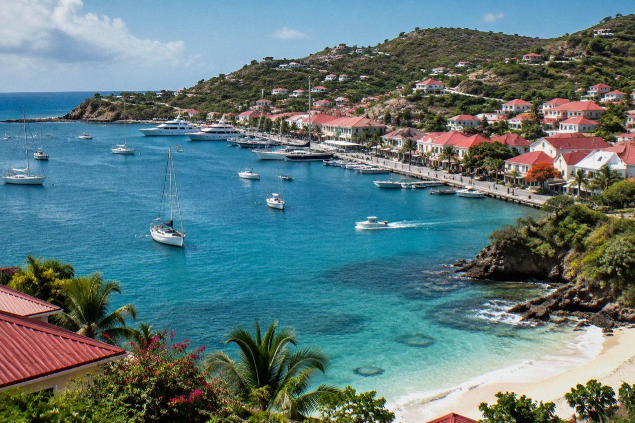 A wooded headland above a quiet turquoise bay on the coast of St Barts
