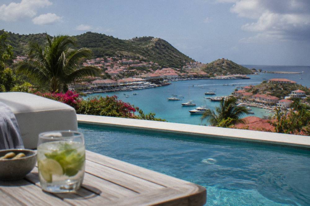 A private villa terrace with a pool overlooking the sea on St Barts