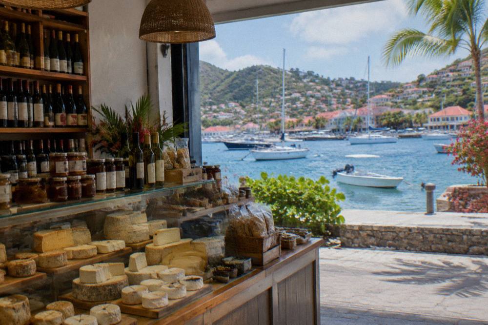 A delicatessen counter with French cheeses, wines and packaged goods in Gustavia