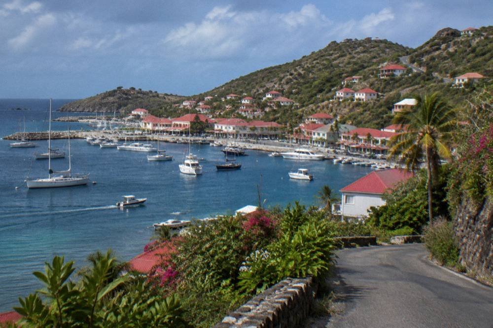 A narrow winding hill road with tropical vegetation on St Barts