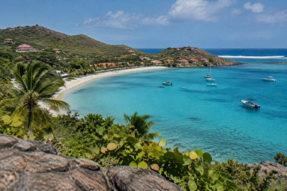 The curving shoreline of Grand Cul-de-Sac bay seen from a hillside on St Barts