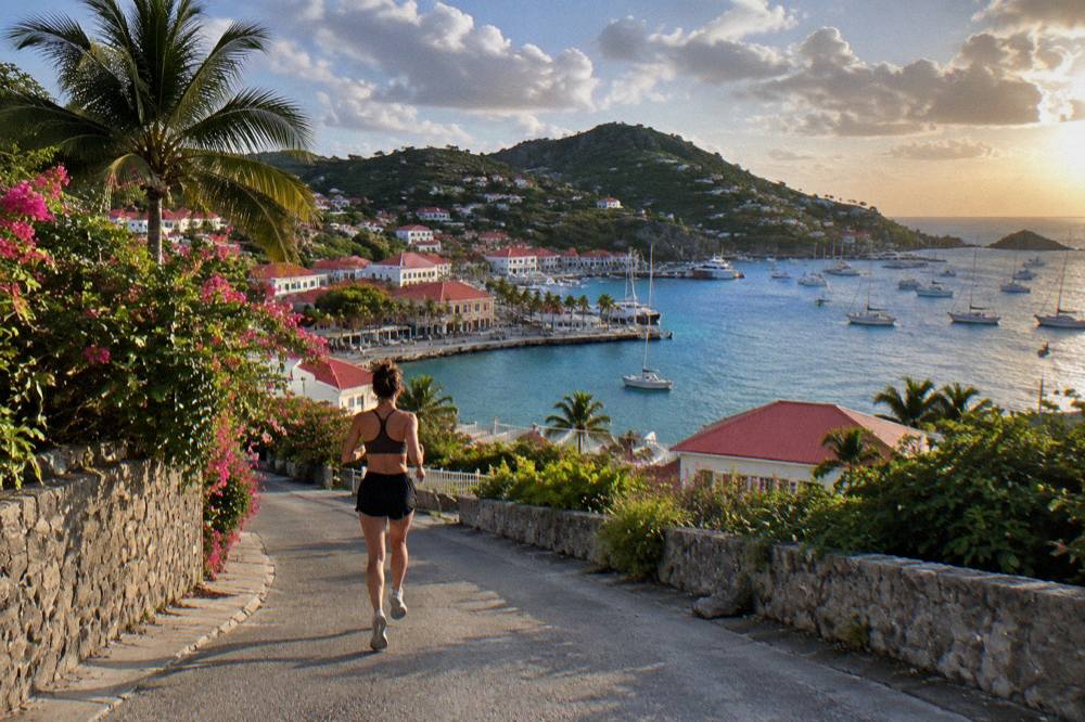 Sunset light over the hills and sea of St Barts seen from a high terrace