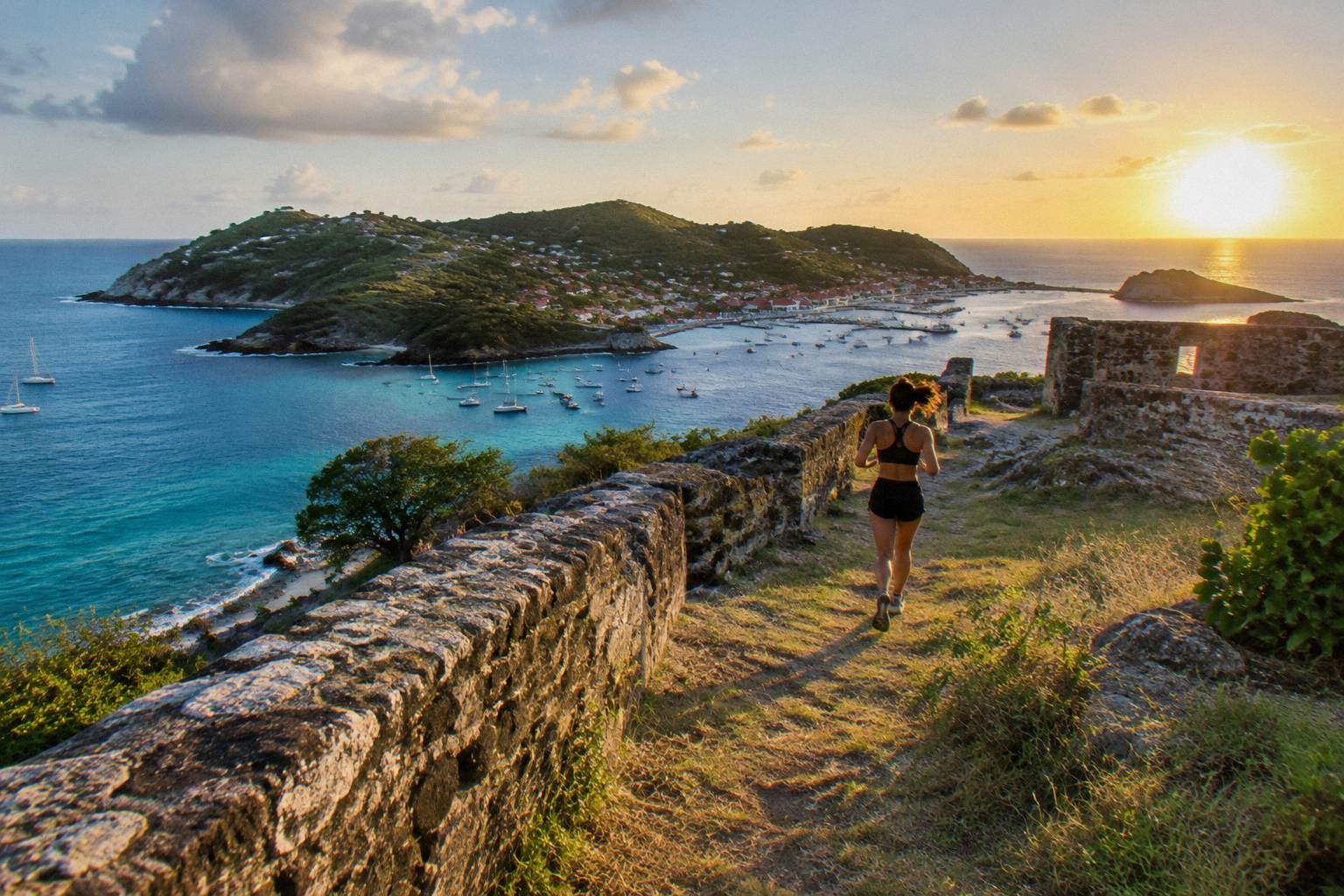Old stone fort walls on a hill above a harbour