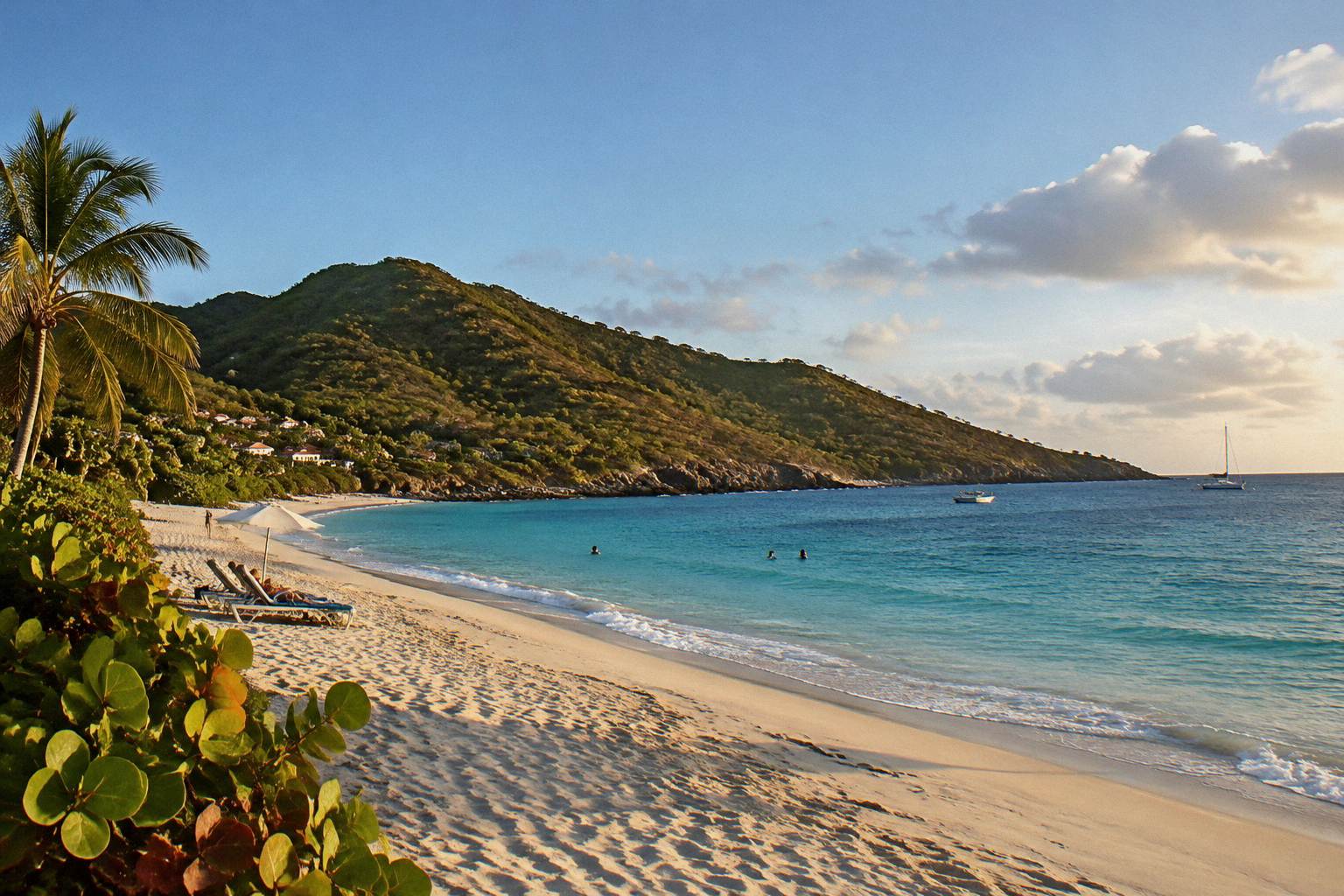 Quiet bay of pale sand beneath green hills