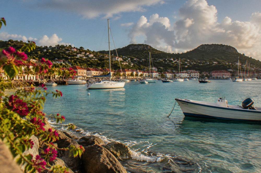 Sunlight over calm turquoise water at a small bay on St Barts
