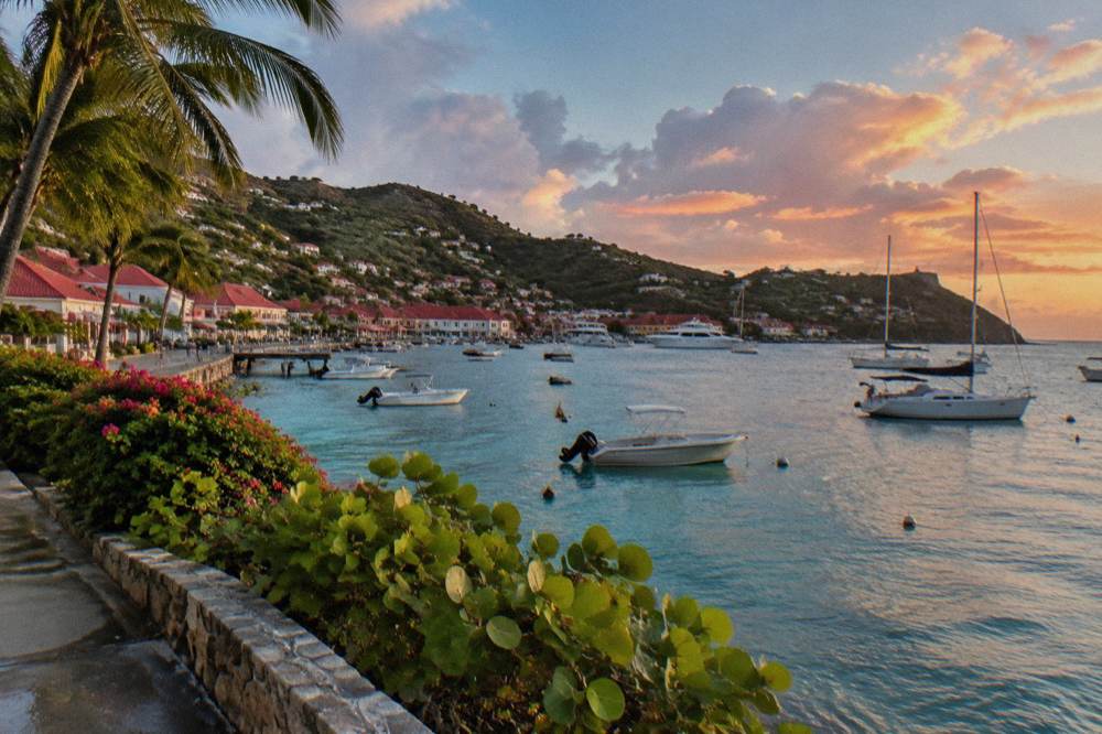 Pink and orange tropical clouds over the Caribbean Sea at dusk on the coast of St Barts