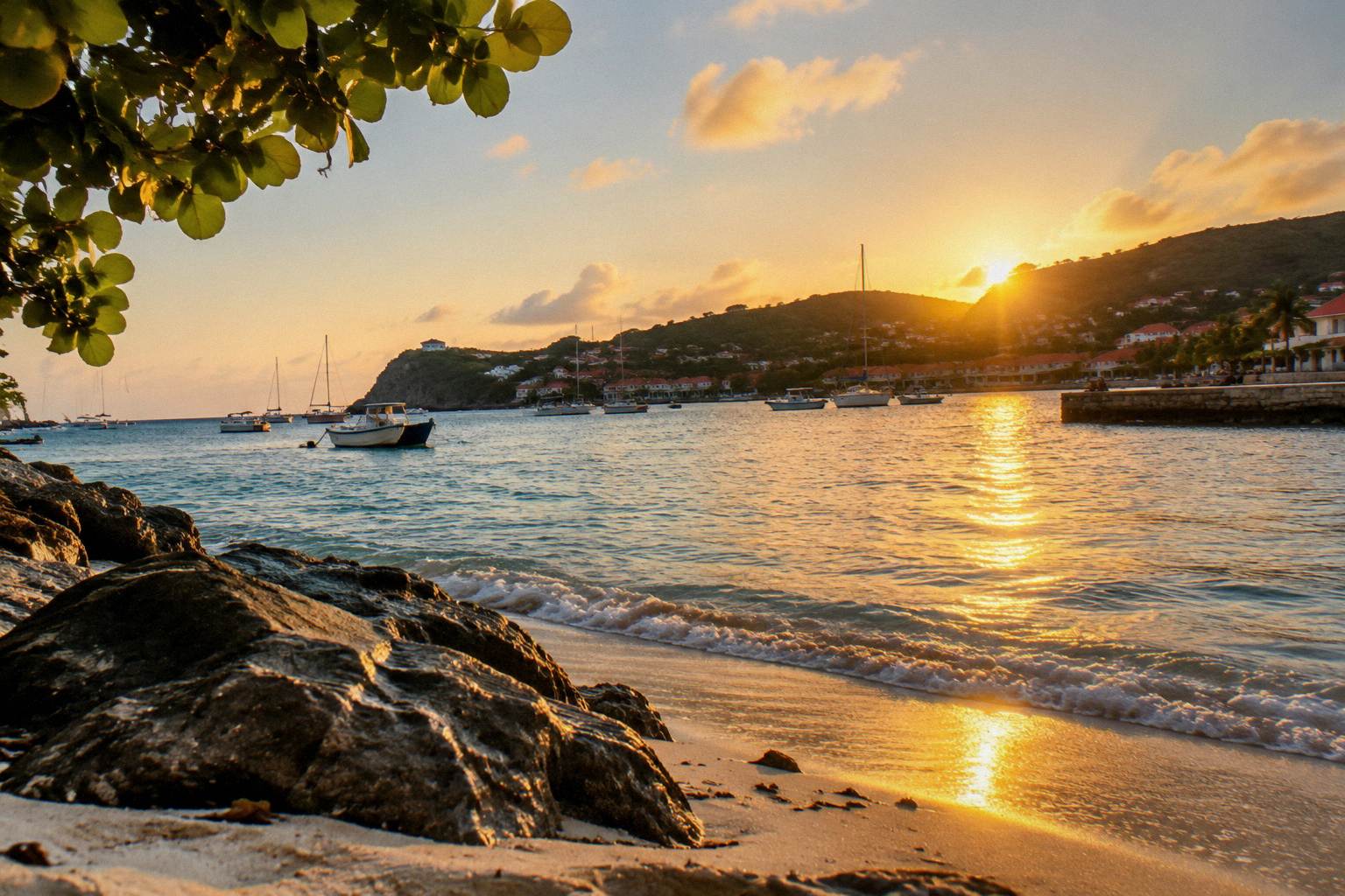 Sun setting over calm water with a headland silhouette in the foreground