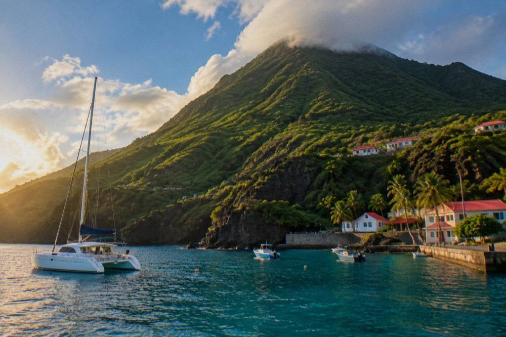 Sailing catamaran at anchor in a quiet Caribbean bay