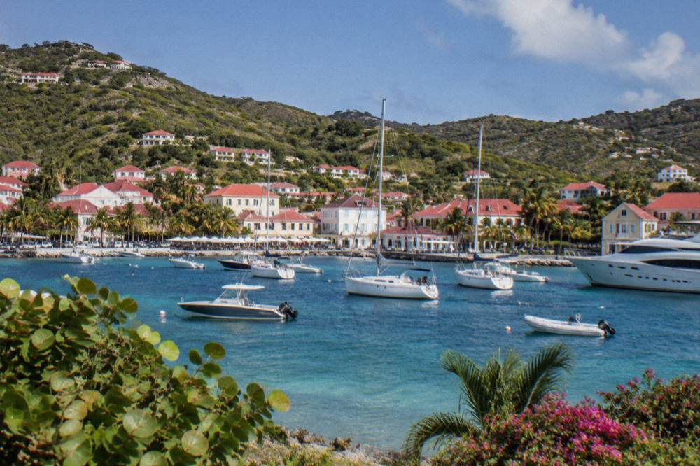 Pastel-colored administrative buildings around a small Caribbean plaza