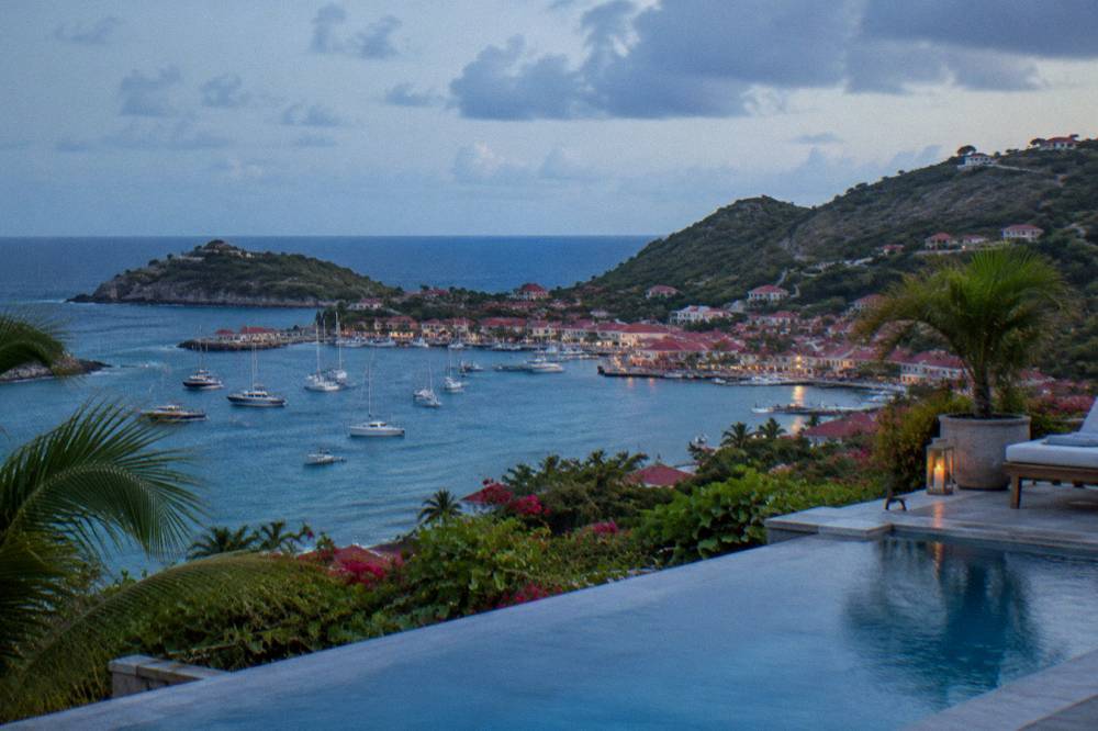 A private villa pool on a hillside overlooking the sea in St Barts
