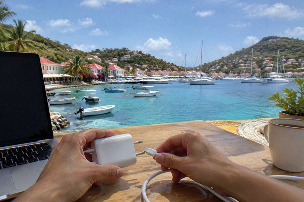 A European style plug adapter being connected to a charger cable on a desk