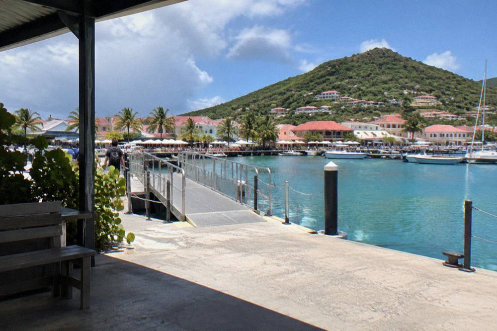 The ferry terminal at Marigot, St Martin, with a boarding ramp and calm water in the marina basin