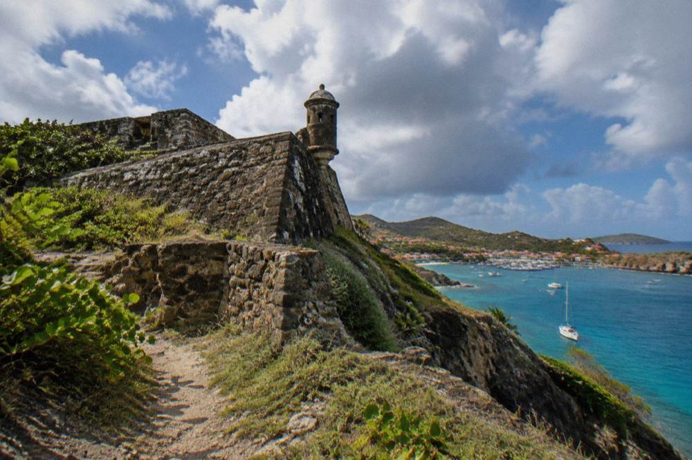 Tender boats and sailing yachts in a small Caribbean harbour town