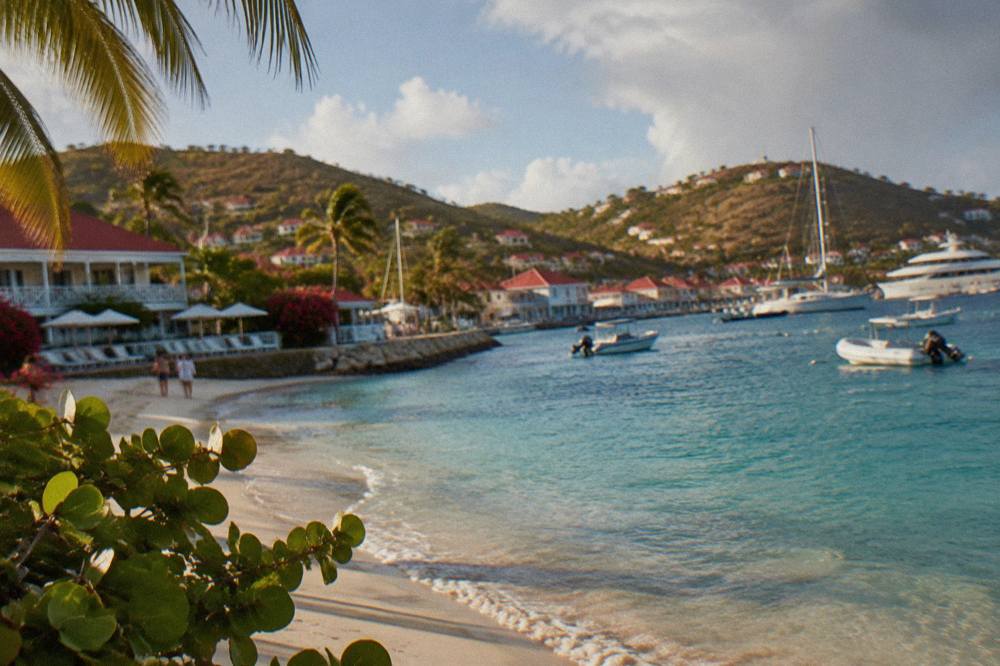 A small luxury hotel beside a turquoise bay with white sand