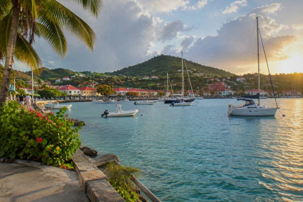 The harbour of Gustavia with boats at anchor and hills behind the town