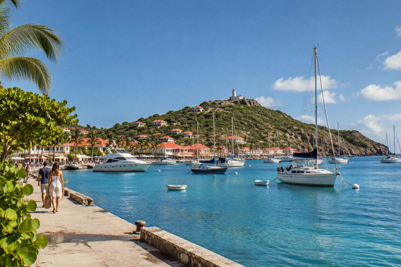 Sailboats anchored in Gustavia harbor under a clear December sky