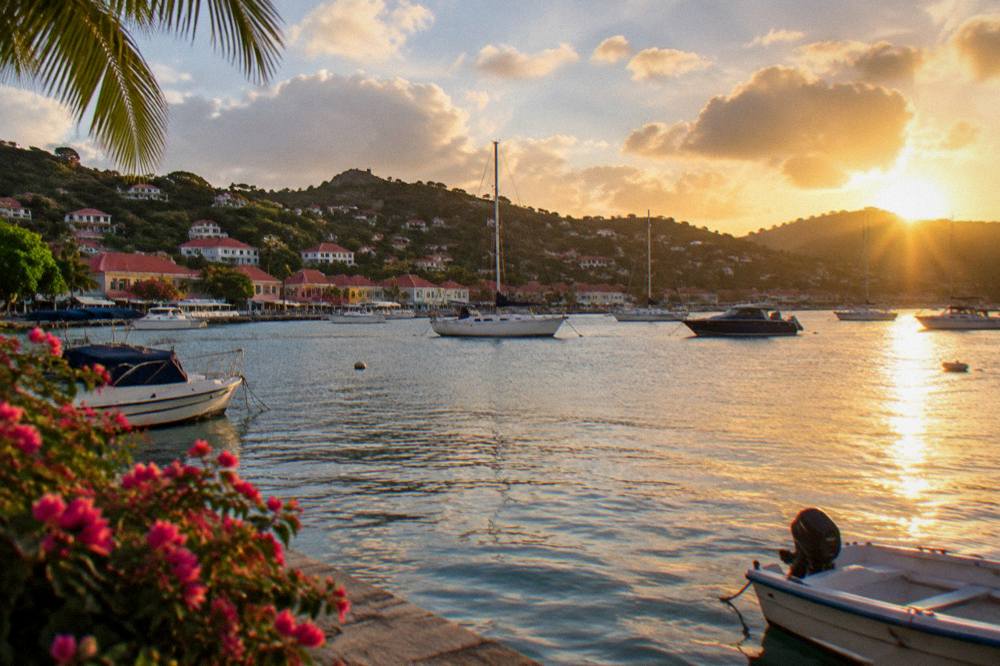 Sunset over anchored boats and the hills of Gustavia in St Barts