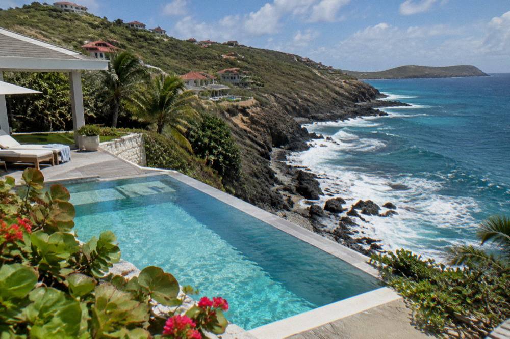 A hillside villa with a private pool overlooking the sea