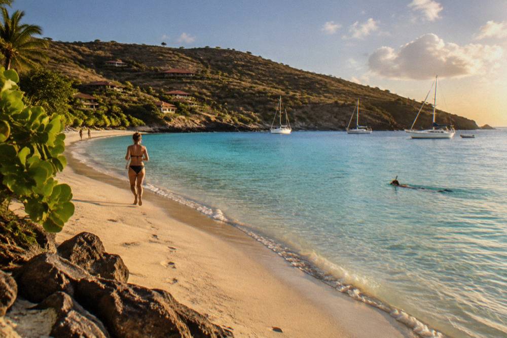 A snorkeler floating calmly on the surface above a sandy lagoon