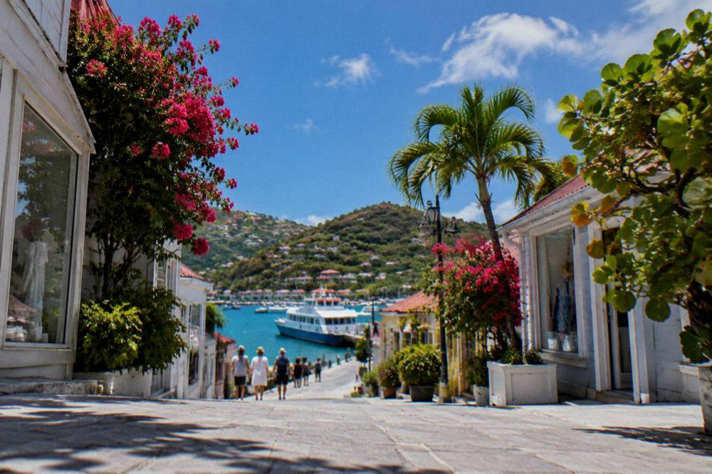 Ferry arriving at a small Caribbean harbor town quay