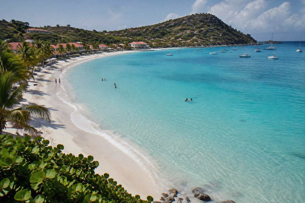 White sand beach at Saint-Jean in St Barts with calm turquoise water in the morning