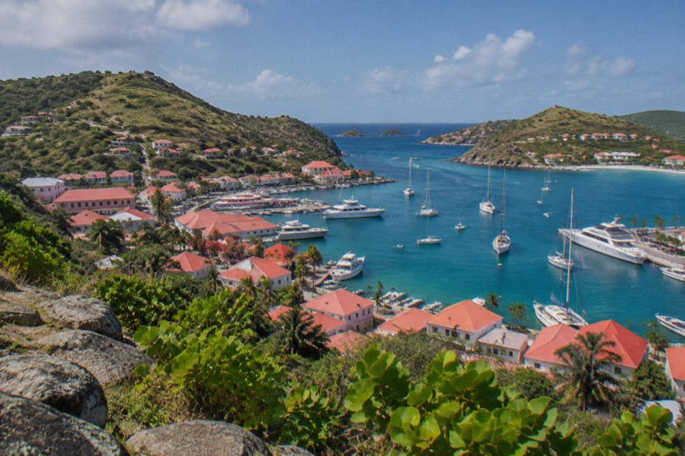 Red roofs of Gustavia seen from a hillside above the harbour