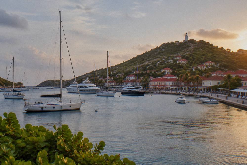 Evening light over Gustavia harbour with yachts at anchor
