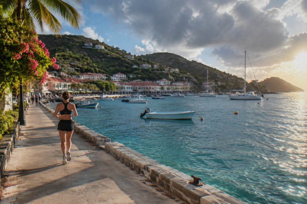 Sun rising over calm Caribbean water along a rocky St Barts coastline