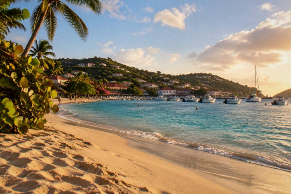 A quiet stretch of public sand on St Barts at the end of the day with soft light on the water