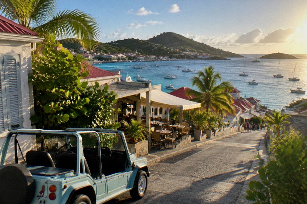 A small open-top rental car parked beside a narrow road with sea views on a hilly island