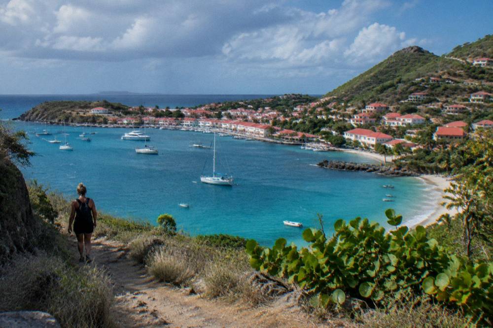 Dry hillside trail descending toward the sea at Colombier beach on St Barts
