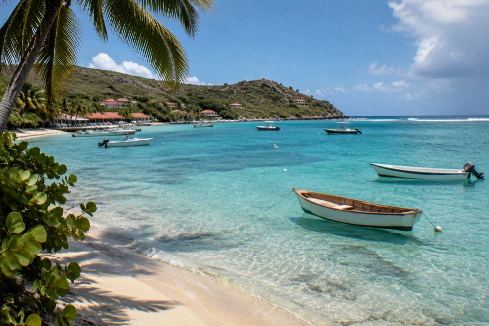 Wooden tenders and small boats moored in the clear shallows of Grand Cul-de-Sac bay on St Barts
