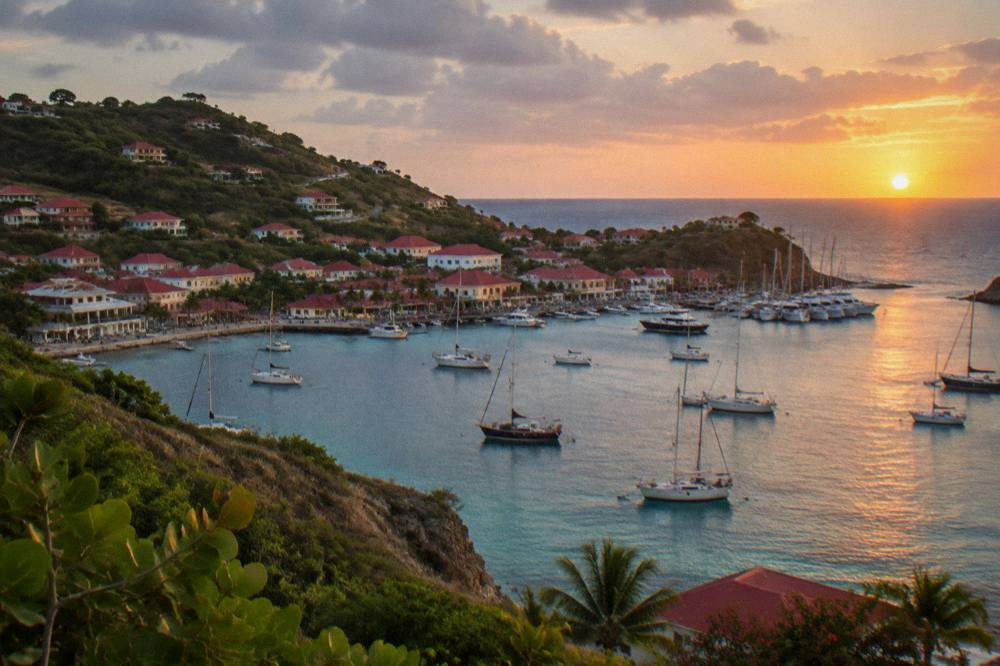 Sun setting over the Caribbean horizon seen from a headland on St Barts