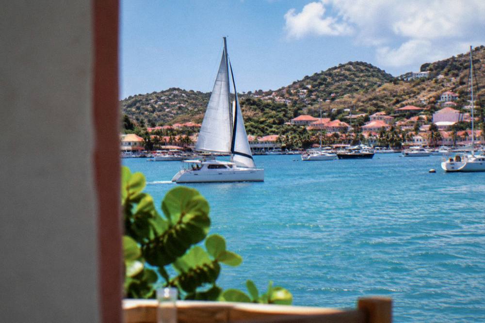 Catamaran under sail in open water between St Martin and St Barts