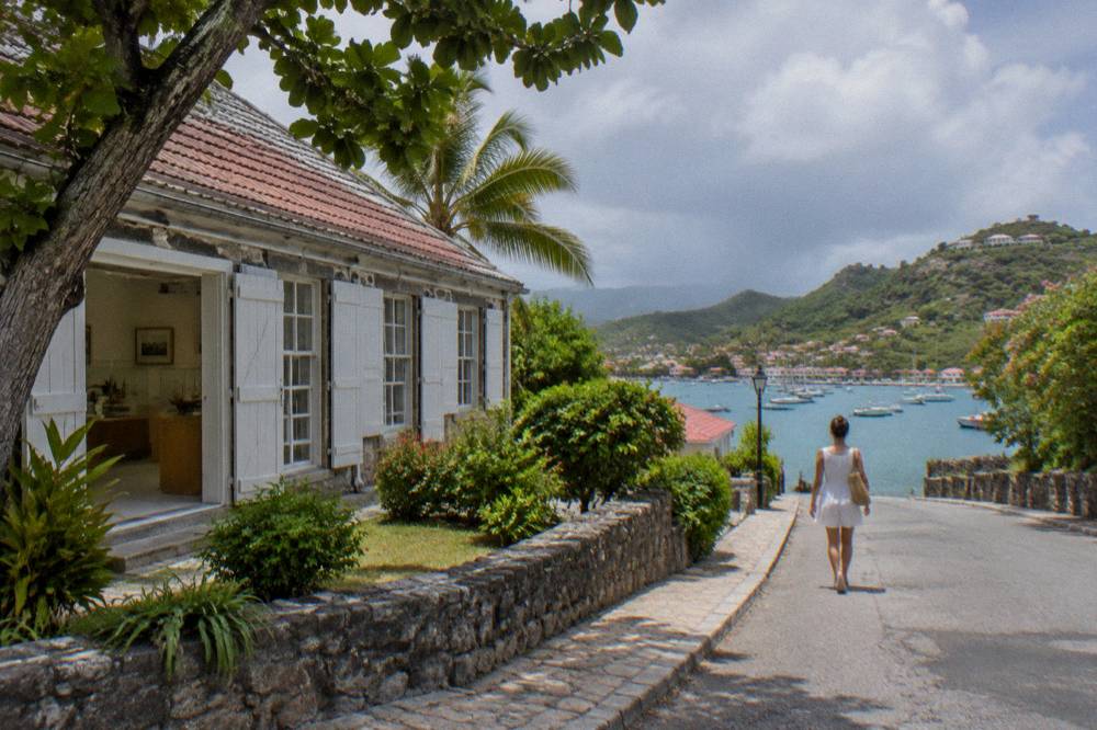 Display cases inside a small island museum with historical maps and artefacts