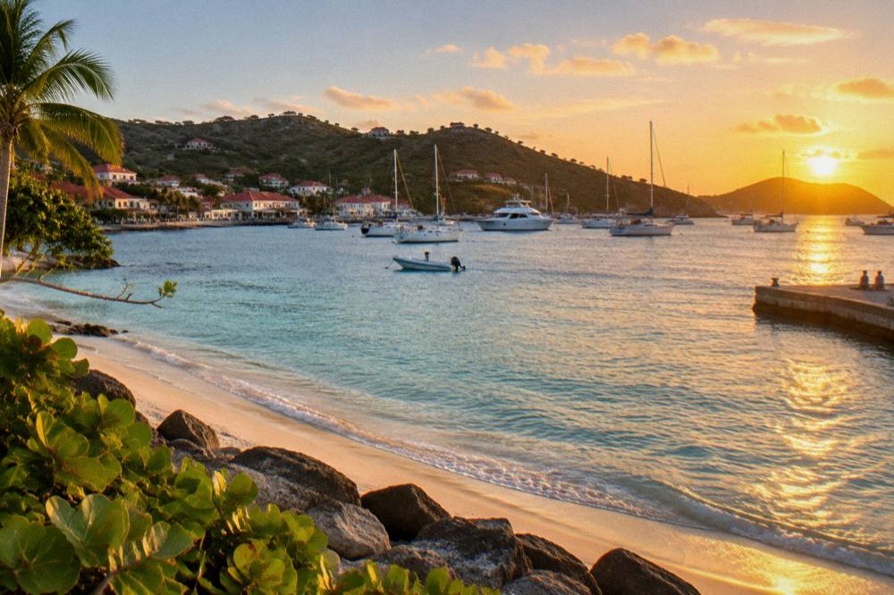 Golden sunset light over a harbor with yachts at anchor and hills behind